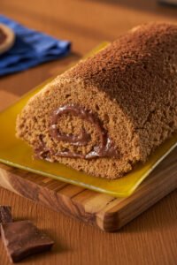 Dia Mundial do Café receitas,bolo moka receita,rocambole de café receita,sobremesas com café,gastronomia café Brasil,receitas com café fáceis,bolo de café cremoso,rocambole recheado chocolate café,como fazer bolo moka,receitas doces com café,café culinária brasileira,sobremesas especiais café,receitas para Dia do Café,preparo de bolo moka,receitas com café solúvel,doces gourmet com café